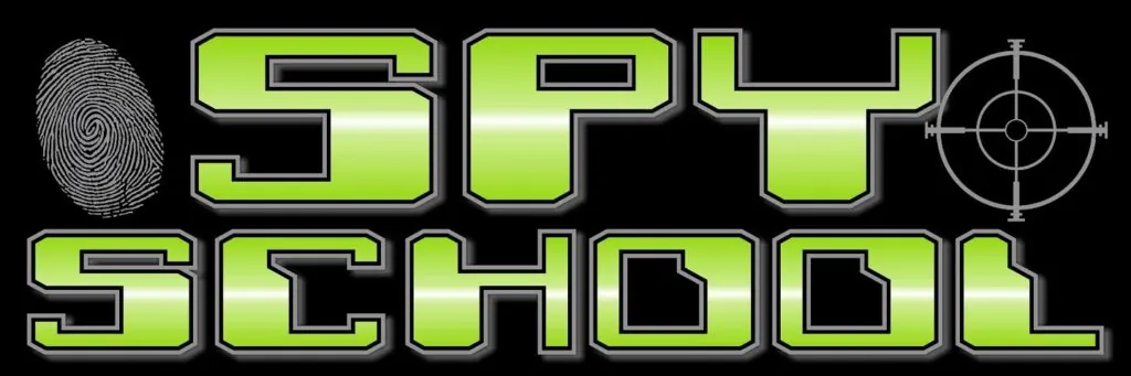 Laptop screen showing Spy Academy interface with a spy-themed activity book on the desk.